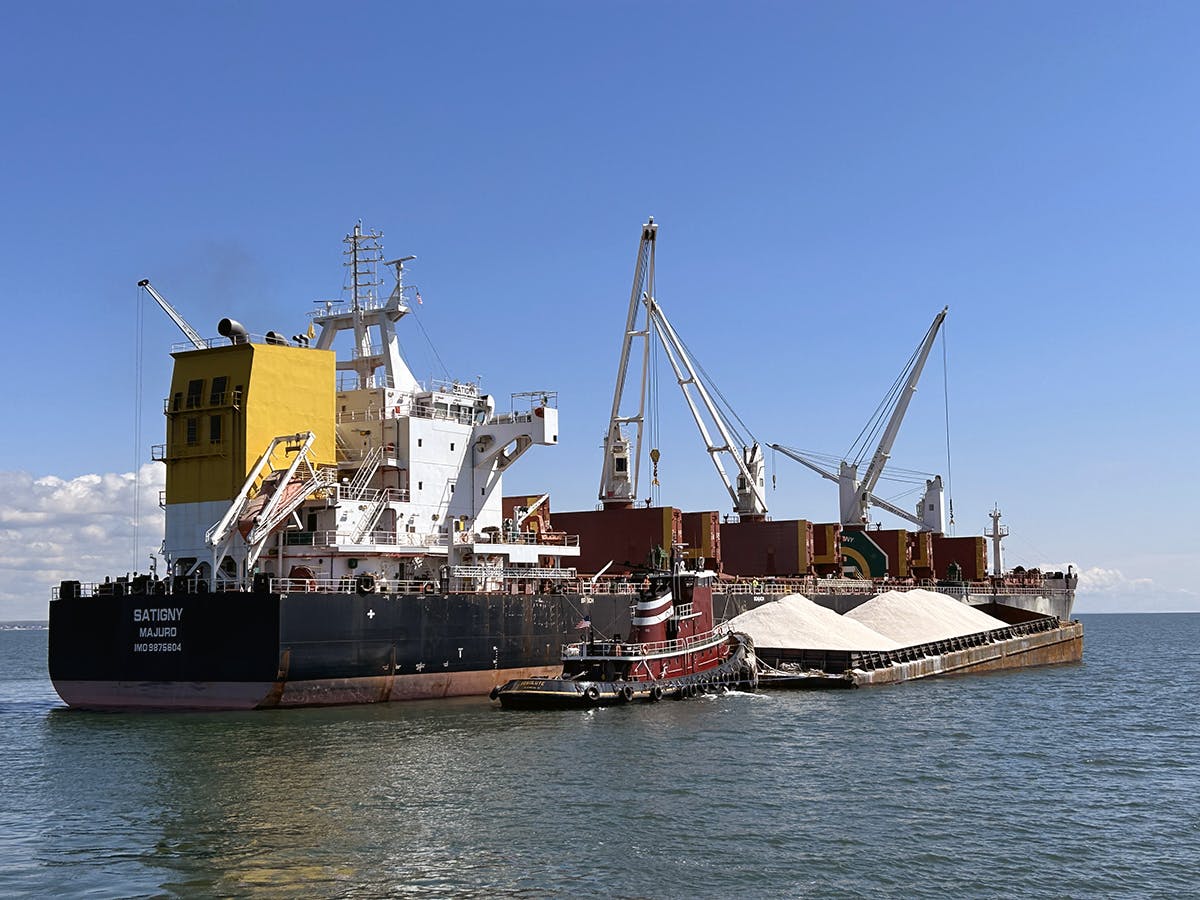 The McAllister tugboat Resolute works a salt barge in Connecticut.